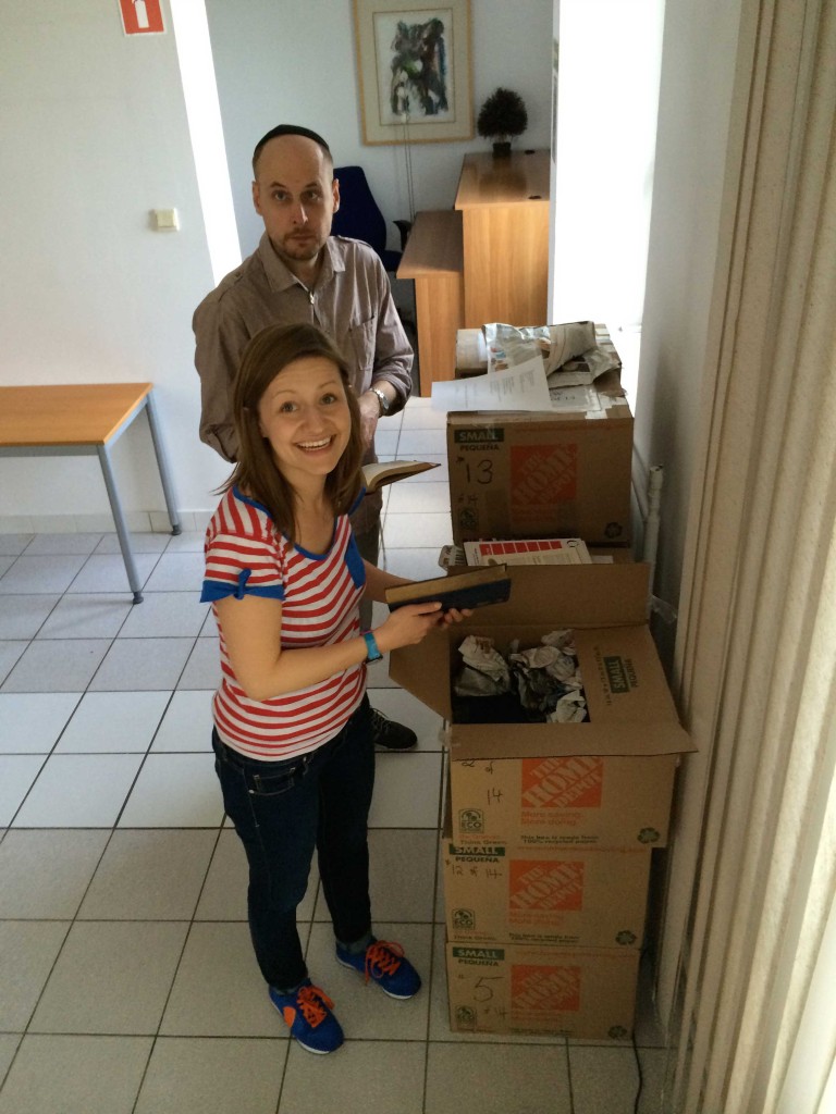 Marta Pilarska and Piotr Klapec unpacking books.