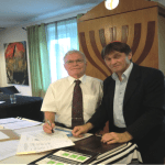 photo: Rabbi Gil Nativ and Chair Piotr Stasiak signing Twinning Document July 20, 2013
